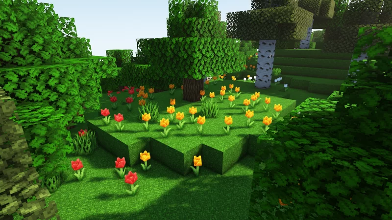 A grassy hill filled with yellow and red flowers in Minecraft.