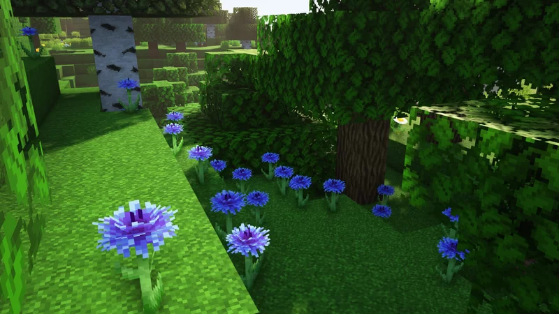 Blue flowers clustered along a forest edge in Minecraft.